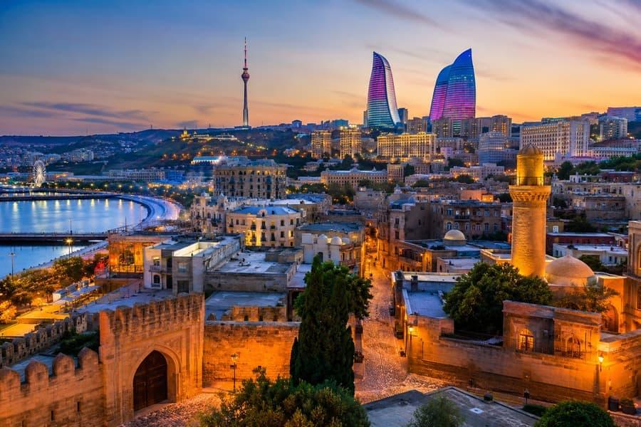 Azerbaijan tourism featuring Baku Old City and the Flame Towers skyline.